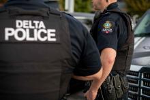 Delta Police officers seen from back and side