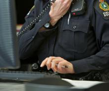Officer on phone at desk