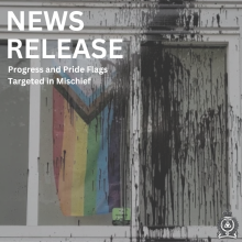 News Release Template Featuring Image of Ladner United Church and Progress Flag with Black Paint