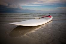 Paddle-board-on-beach-scaled-e1601674352448.jpg
