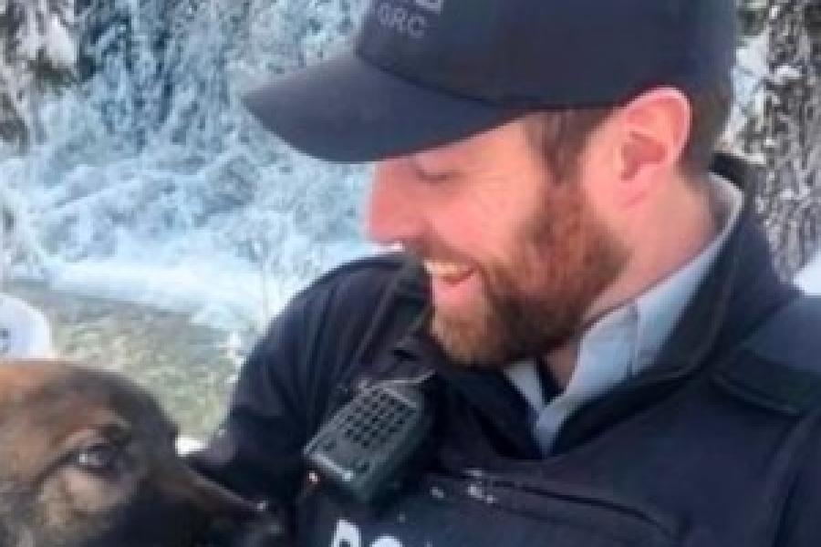 Kyle Stubbs in RCMP uniform with police dog